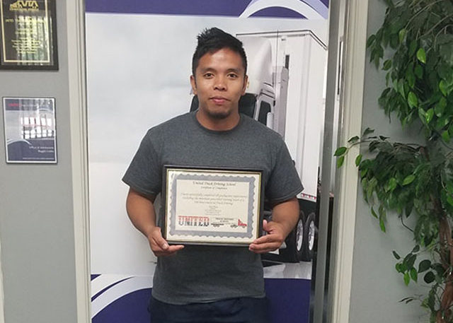 Image of Julius S with CDL certificate