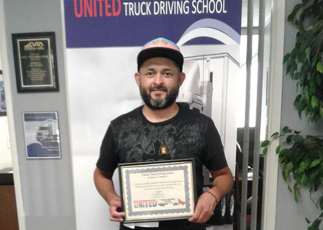 Image of Carlos with CDL certificate
