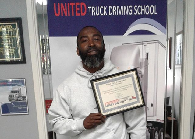 Image of Kenneth with certificate