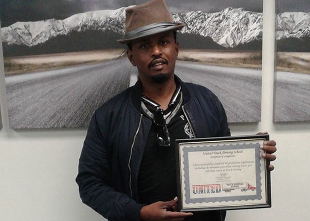 Image of Mohamed Omar with certificate