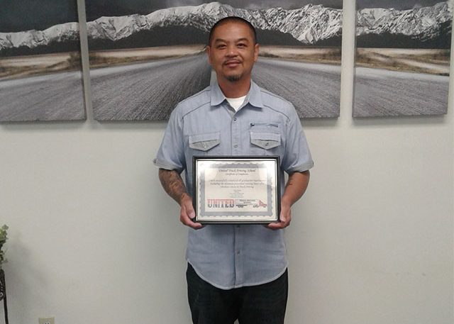 Image of Arnold O with certificate