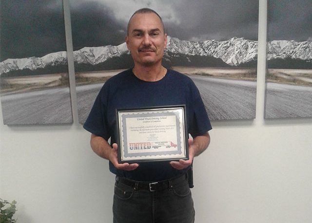 Image of Jamie D with certificate