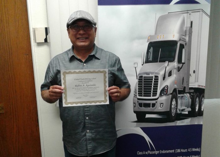 Image of Rufino Aguinaldo with certificate