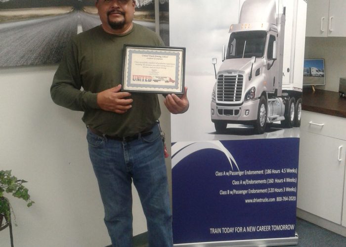 Image of Sergio Martinez standing with his certificate