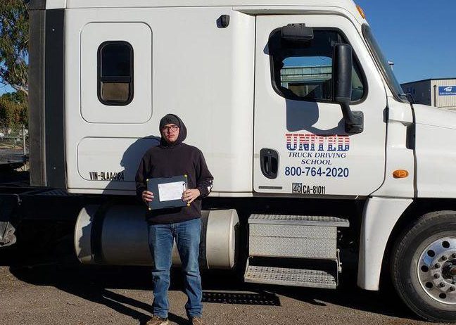 image of Dustin Cook in front of United truck