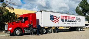Image of two people standing near a United Truck Driving School Class A CDL training truck