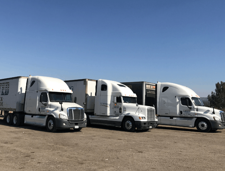 Three United semi truck parked in a row in training lot